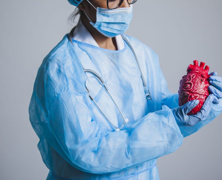 surgeon-posing-with-heart